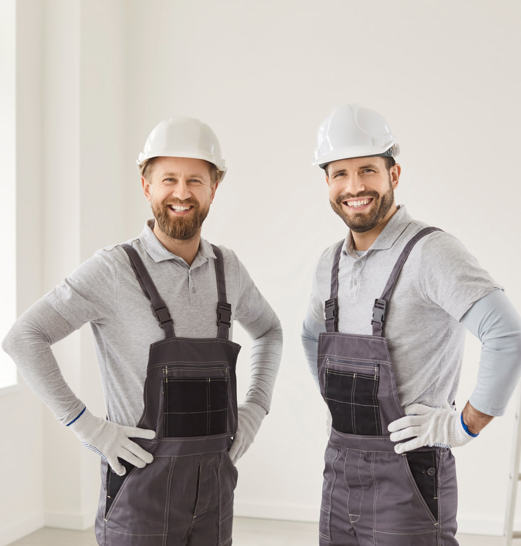 Two men with hard hats and overalls